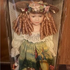 Vintage Porcelain Doll with Floral Dress and Hat